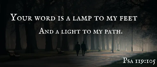 Two people walking a lamplit path. Your word is a lamp to my feet and a light to my path, Psalm 119:105.
